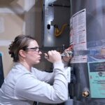 Brittany from PowerPuff Plumbing installing water heater